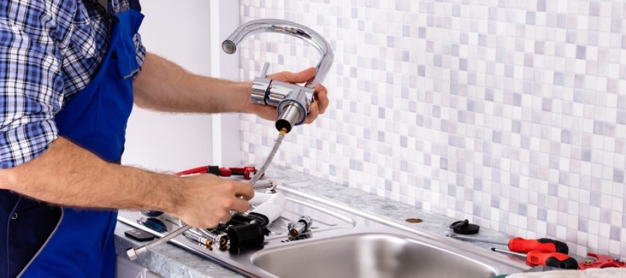 Mid,Section,Of,Male,Plumber,Assembling,The,Kitchen,Sink,Faucet